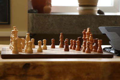 Close-up of chess pieces on table