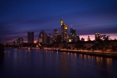 Illuminated buildings in city at night in frankfurt, germany 