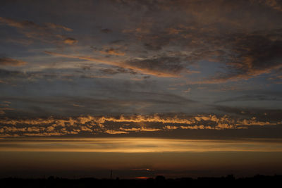 Low angle view of dramatic sky during sunset