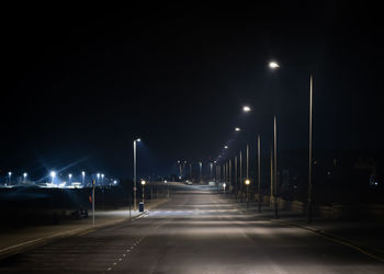 Illuminated road at night