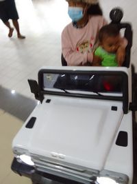 Rear view of people in car