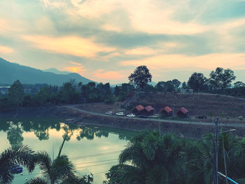 Scenic view of lake against sky during sunset