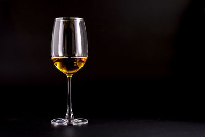 Close-up of wineglass on table