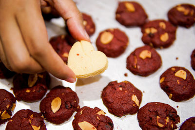 Midsection of person holding cookies