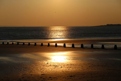 Scenic view of sea at sunset