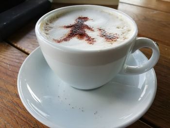 Close-up of cappuccino on table