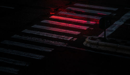 High angle view of illuminated cross walk at night 