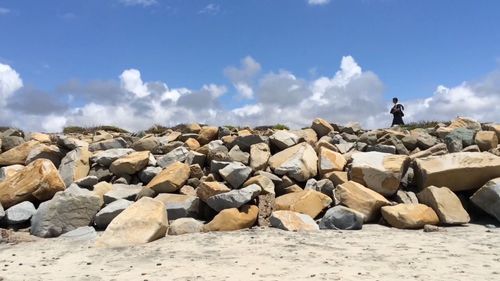 Scenic view of sea against cloudy sky