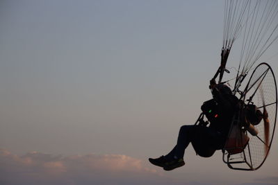 Low angle view of silhouette camera against sky at sunset