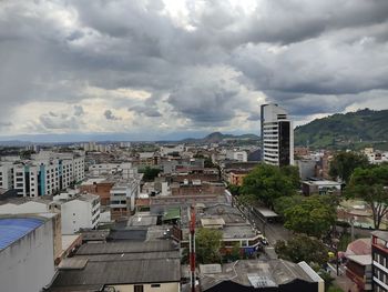 High angle view of buildings in city against sky