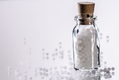 Close-up of drink in glass against white background