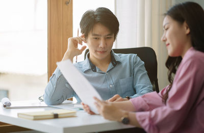 Business colleagues working at office
