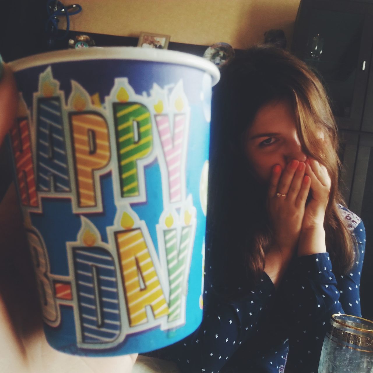 CLOSE-UP OF A WOMAN DRINKING COFFEE WITH CUP