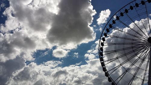 Low angle view of ferris wheel against sky
