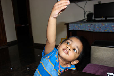 Cute boy playing at home