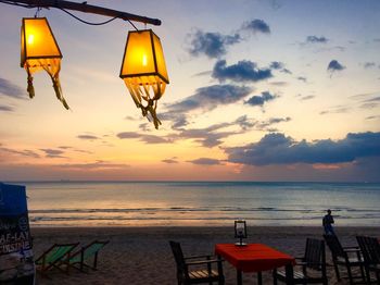 Scenic view of beach against sky during sunset