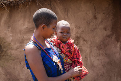 Mother and girl looking at camera