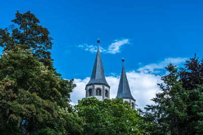 Low angle view of church against blue sky