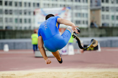 Rear view of male athlete with amputated leg