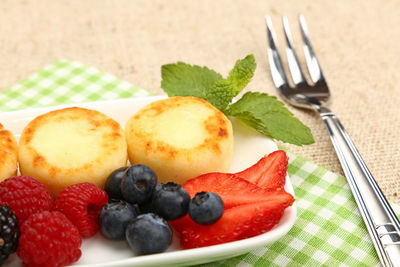 Close-up of dessert and fruits in plate