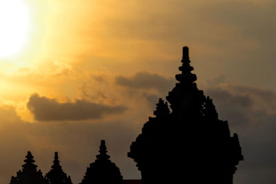 Silhouette temple against sky during sunset