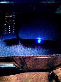 Close-up of illuminated light bulb on table