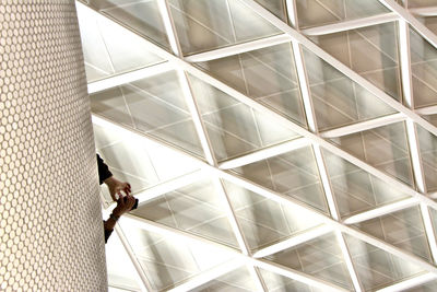 High angle view of man walking on floor in building