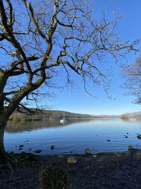 Scenic view of lake against blue sky