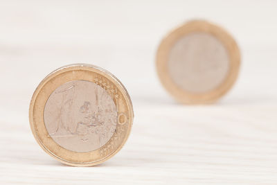 Close-up of coin on table