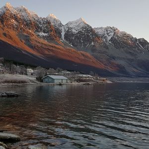 Scenic view of snowcapped mountains against sky during winter