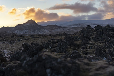 Scenic view of beach against sky during sunset