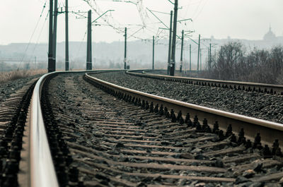 Surface level of railroad tracks against sky