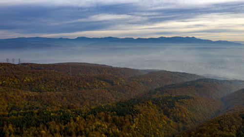 Scenic view of landscape and mountains against sky