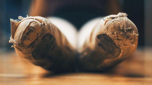 Close-up of old ballet shoes on table