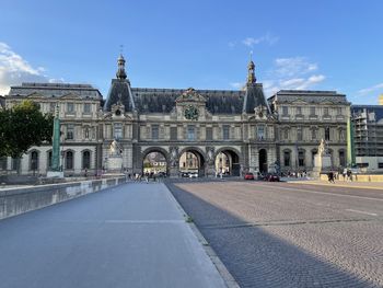 View of a historic gateway to the louvre against sky