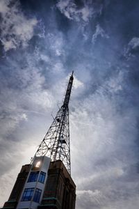 Low angle view of crane against sky