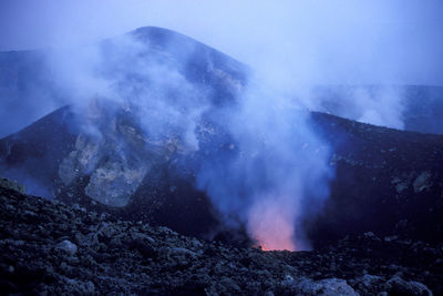 Smoke emitting from volcanic mountain