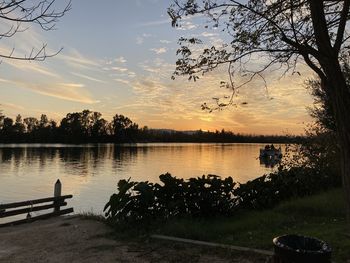 Scenic view of lake against sky during sunset
