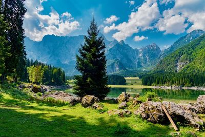 Scenic view of lake and mountains against sky