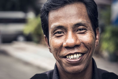 Close-up portrait of smiling man