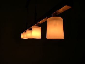 Close-up of illuminated light bulb in darkroom