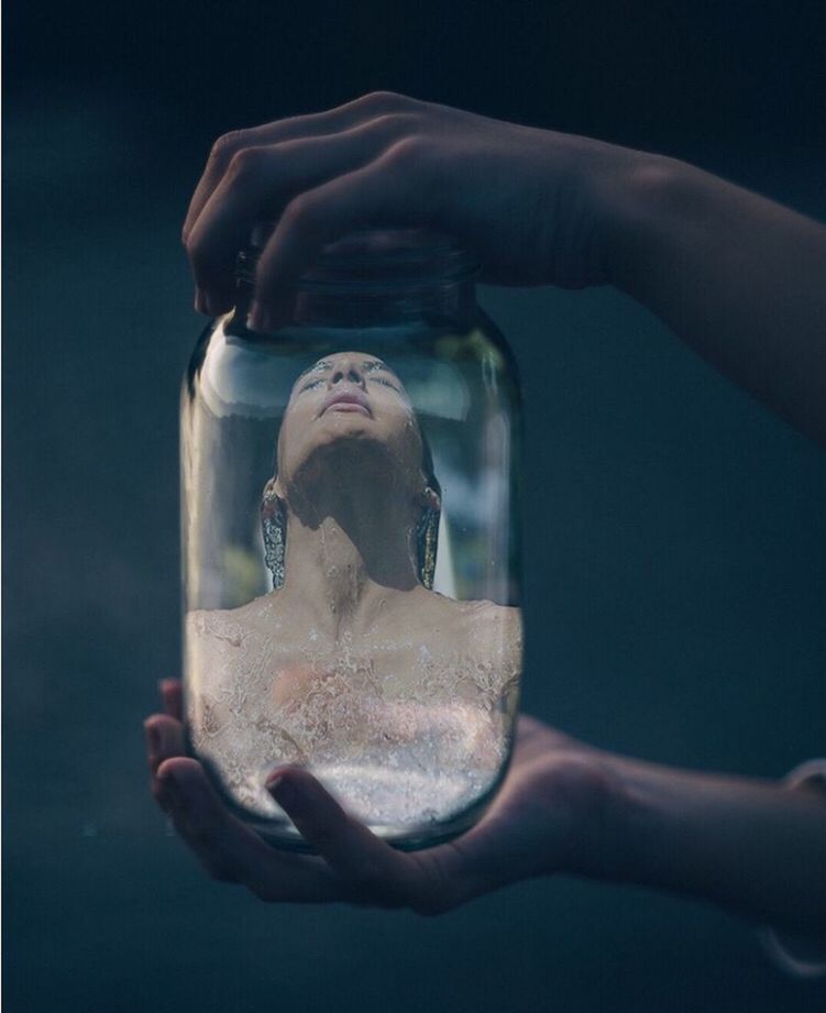 CLOSE-UP OF WOMAN HAND HOLDING GLASS OF BOTTLE