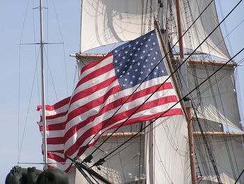 Low angle view of flag against sky