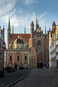 Buildings in city against sky