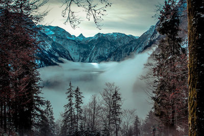 Scenic view of snow covered mountains against sky