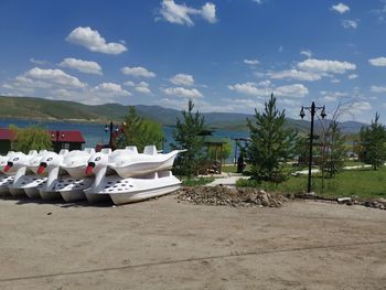 Boats on land against sky