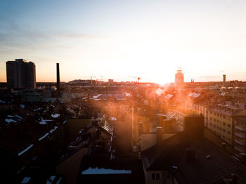 High angle view of cityscape against sky during sunset