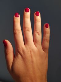 Close-up of human hand against black background