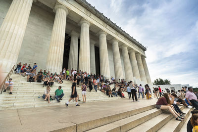 People in front of historical building