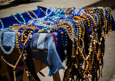 Close-up of multi colored jewelry hanging at store